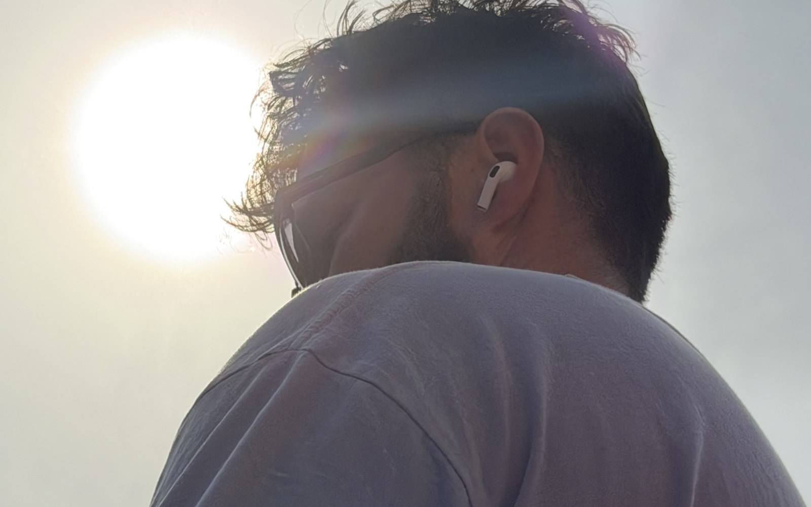 The sun behind a hooper's shoulder before a night run at Commercial Park, Chicago.